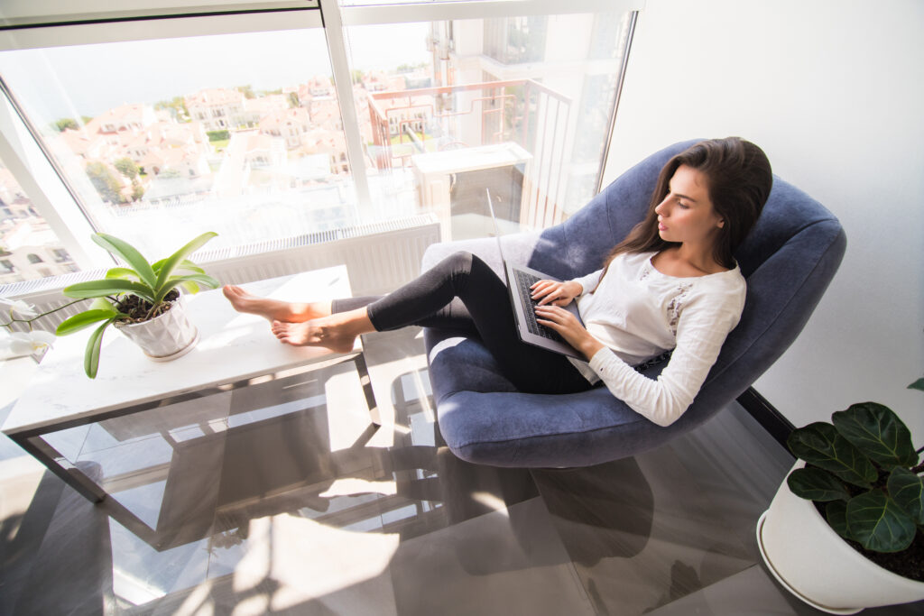 Small home office corner with natural light and minimal desk setup for remote work