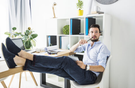 Professional working remotely from home using laptop and digital tools