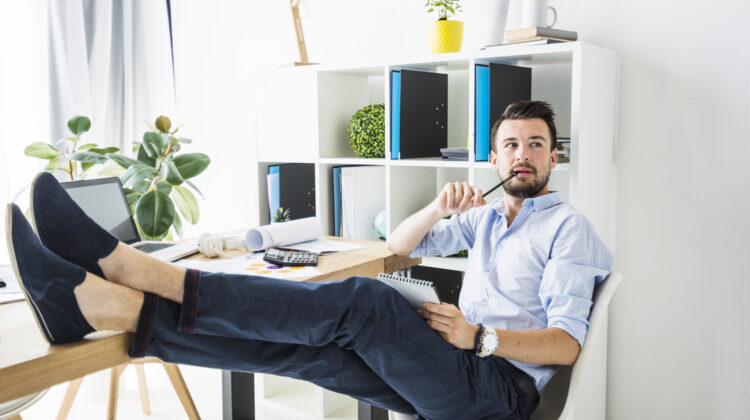 Professional working remotely from home using laptop and digital tools